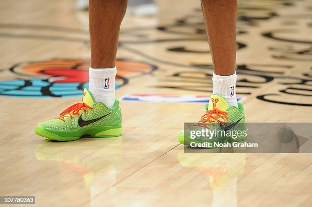 Kobe Bryant of the Los Angeles Lakers warms up wearing green Nike Zoom Kobe VI shoes before taking on the Miami Heat at Staples Center on December...