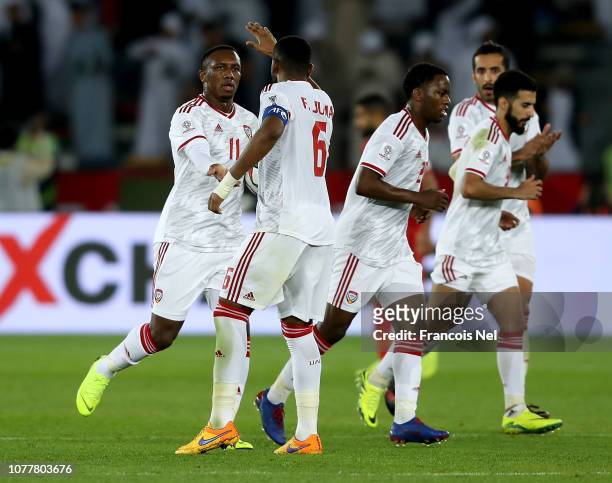 Ahmed Aljunaibi of UAE celebrates with team-mates after scoring his teams first goal during the AFC Asian Cup Group A match between United Arab...