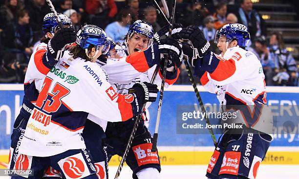 The team of Berlin celebrates after Jens Baxmann of Berlin scored his team's second goal during the DEL match between Hamburg Freezers and Eisbaeren...