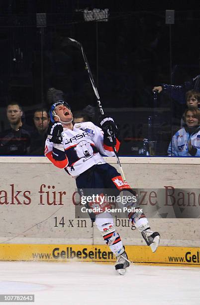 Andre Rankel of Berlin celebrates after scoring his team's third goal during the DEL match between Hamburg Freezers and Eisbaeren Berlin at the O2...