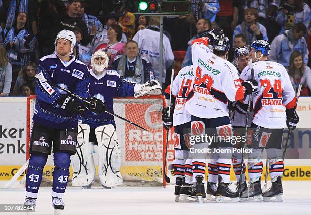 The team of Berlin celebrates after Derrick Walser of Berlin scored his team's second goal during the DEL match between Hamburg Freezers and...