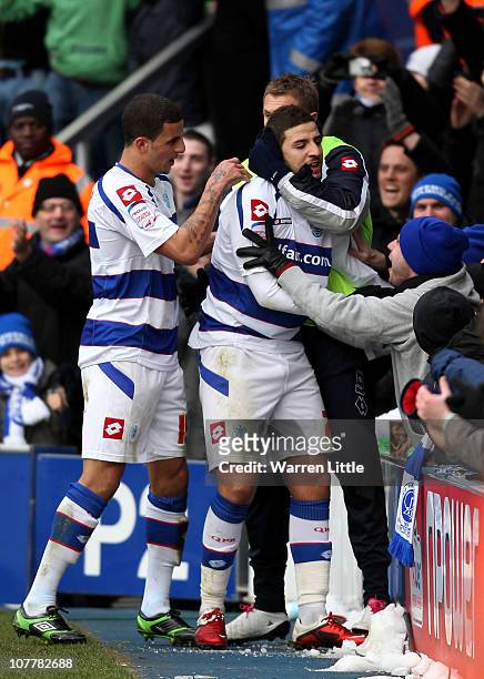 Adel Taarabt of Queens Park Rangers is congratulated by his team mates after scoring the fourth goal during the npower Championship match between...