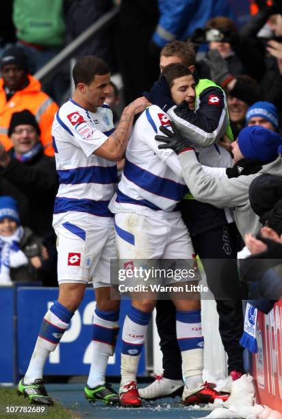 Adel Taarabt of Queens Park Rangers is congratulated by his team mates after scoring the fourth goal during the npower Championship match between...