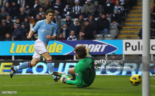 Gareth Barry of Manchester City scores the opening goal past goalkeeper Tim Krul of Newcastle United during the Barclays Premier League match between...