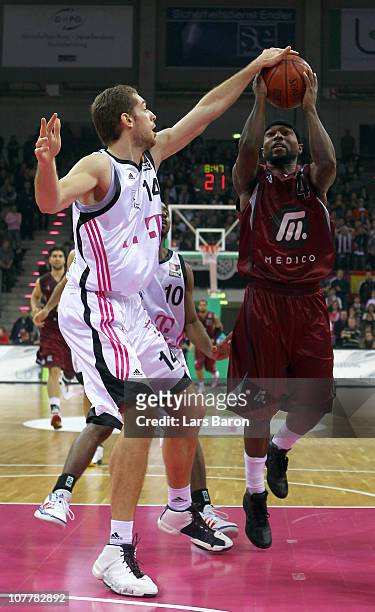 Tim Ohlbrecht of Bonn challenges Tyrese Rice of Artland during the Beko Basketball Bundesliga match between Telekom Baskets Bonn and Artland Dragons...