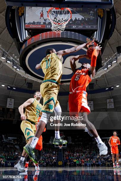Jalen Carey of the Syracuse Orange goes to the basket against Juwan Durham of the Notre Dame Fighting Irish in the second half of the game at Purcell...