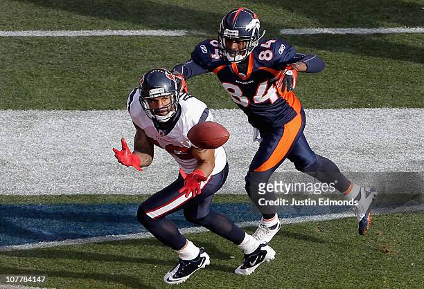 Jason Allen of the Houston Texans intercepts a pass in the end zone intended for Brandon Lloyd of the Denver Broncos during the first quarter at...