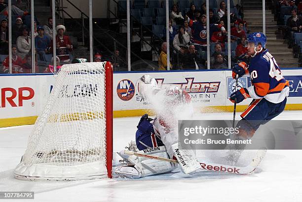 Michael Grabner of the New York Islanders scores a second period goal against Carey Price of the Montreal Canadiens at the Nassau Coliseum on...