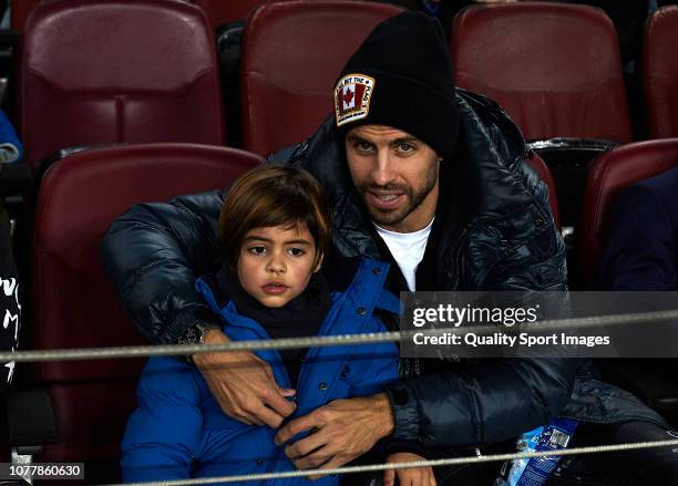 Gerard Pique of FC Barcelona looks on with his son Milan Pique during the Spanish Copa del Rey second leg match between FC Barcelona and Cultural...