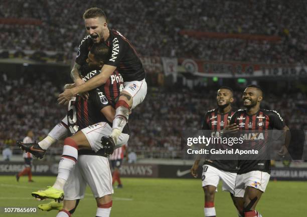 Pablo of Paranaense celebrates with teammate Leo Pereira after scoring the first goal to Junior during the first leg of the final of Copa...
