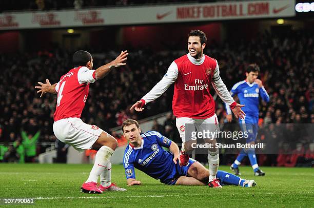 Cesc Fabregas of Arsenal celebrates Arsenal's second goal with Theo Walcott during the Barclays Premier League match between Arsenal and Chelsea at...