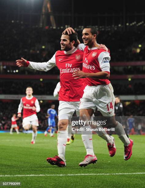 Cesc Fabregas of Arsenal celebrates Arsenal's second goal with Theo Walcott during the Barclays Premier League match between Arsenal and Chelsea at...