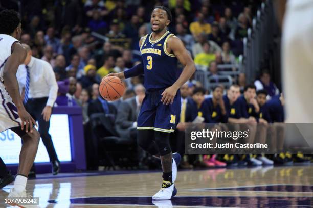 Zavier Simpson of the Michigan Wolverines brings the ball up the court in the game against the Northwestern Wildcats in the first half at Welsh-Ryan...