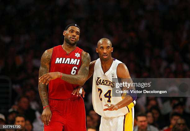 Kobe Bryant of the Los Angeles Lakers defends LeBron James of the Miami Heat during the NBA game at Staples Center on December 25, 2010 in Los...