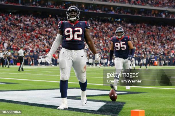 Brandon Dunn of the Houston Texans celebrates after an interception in the first quarter against the Indianapolis Colts during the Wild Card Round at...