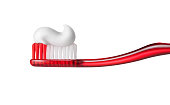 Toothbrush with toothpasteon on white background