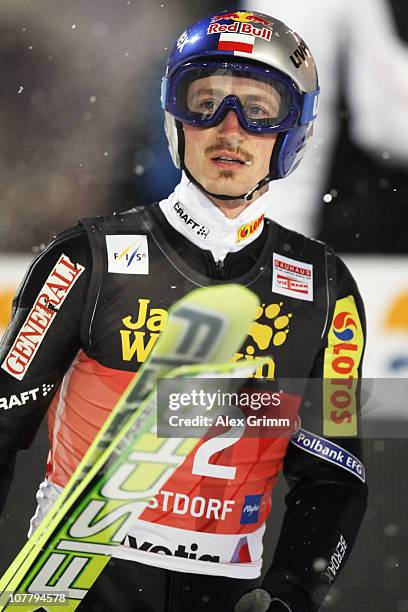 Adam Malysz of Poland reacts after his jump during the qualification round for the FIS Ski Jumping World Cup event at the 59th Four Hills ski jumping...