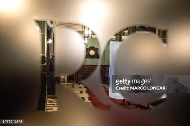 Picture taken on December 6, 2018 shows the logo of the Rand Club on a stained glass in Johannesburg. - The imposing Edwardian-style Rand club in...
