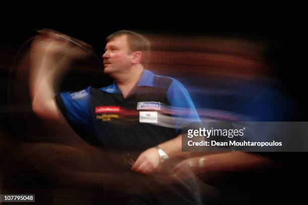 Terry Jenkins of England in action against Steve Brown of England during day 10 in the 2011 Ladbrokes.com World Darts Championship at Alexandra...