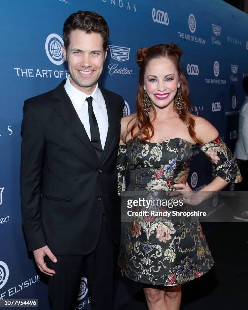 Drew Seeley and Amy Paffrath attend Michael Muller's HEAVEN, presented by The Art of Elysium, on January 5, 2019 in Los Angeles, California.