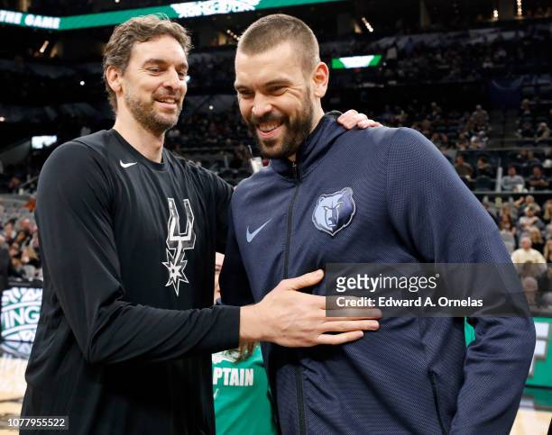Pau Gasol of the San Antonio Spurs talks with his brother Marc Gasol of the Memphis Grizzlies before an NBA game held January 5, 2019 at the AT&T...
