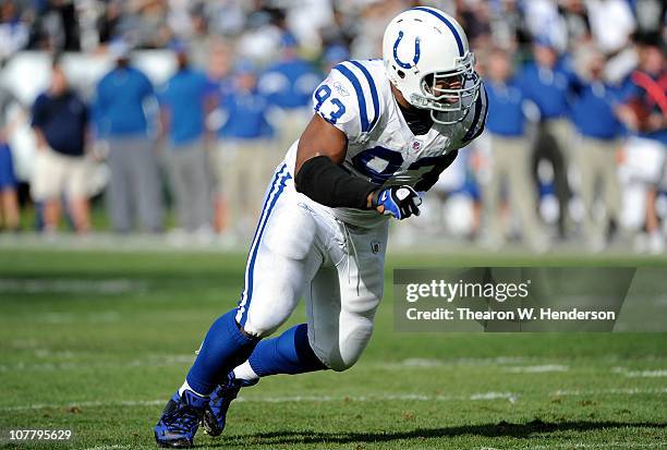 Dwight Freeney of the Indianapolis Colts pursues the play against the Oakland Raiders during an NFL football game at The Oakland-Alameda County...