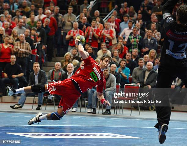 Mario Cloessner of Ahlen-Hamm scores against Per Sandstroem of Hamburg during the Toyota Handball Bundesliga match between HSG Ahlen-Hamm and HSV...
