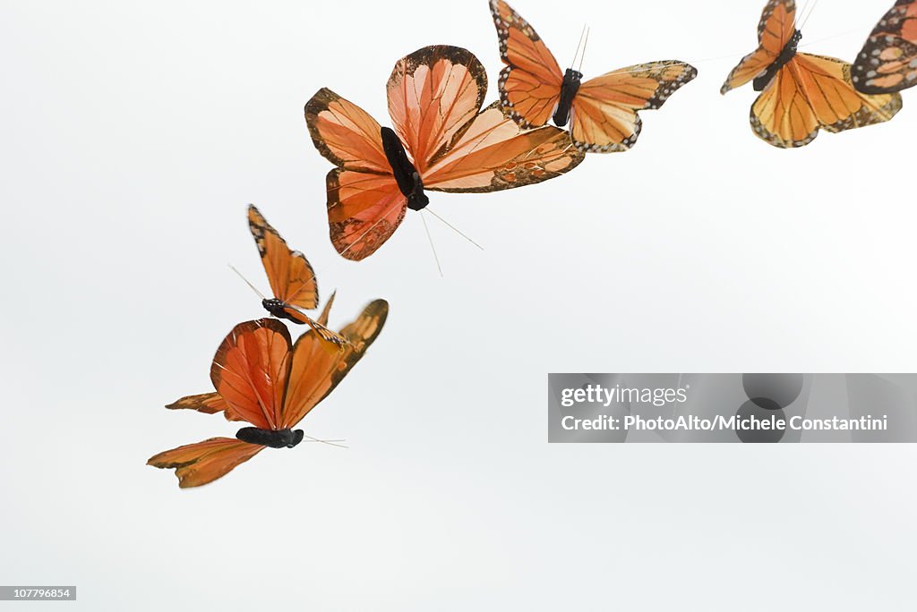 Artificial butterflies flying