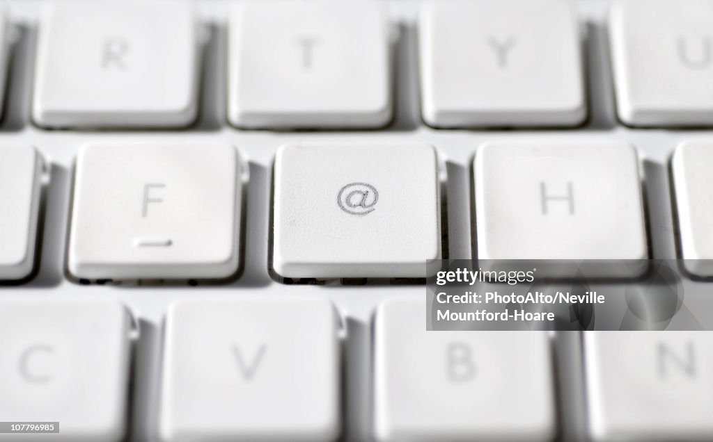 At Least Computer. Sign At Sign On Laptop Computer Keyboard High-Res Stock Photo - Getty Images