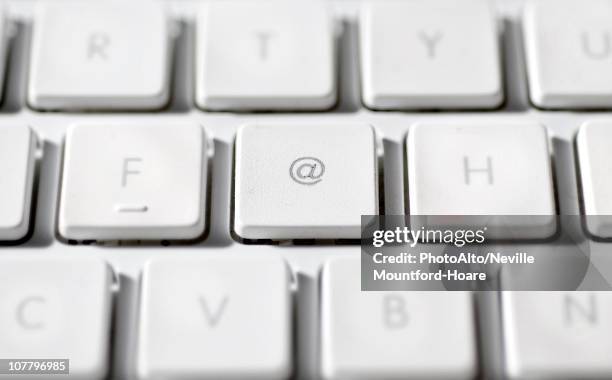 at sign on laptop computer keyboard - 'at' symbol stock pictures, royalty-free photos & images