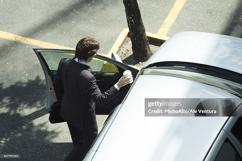 Businessman getting into car