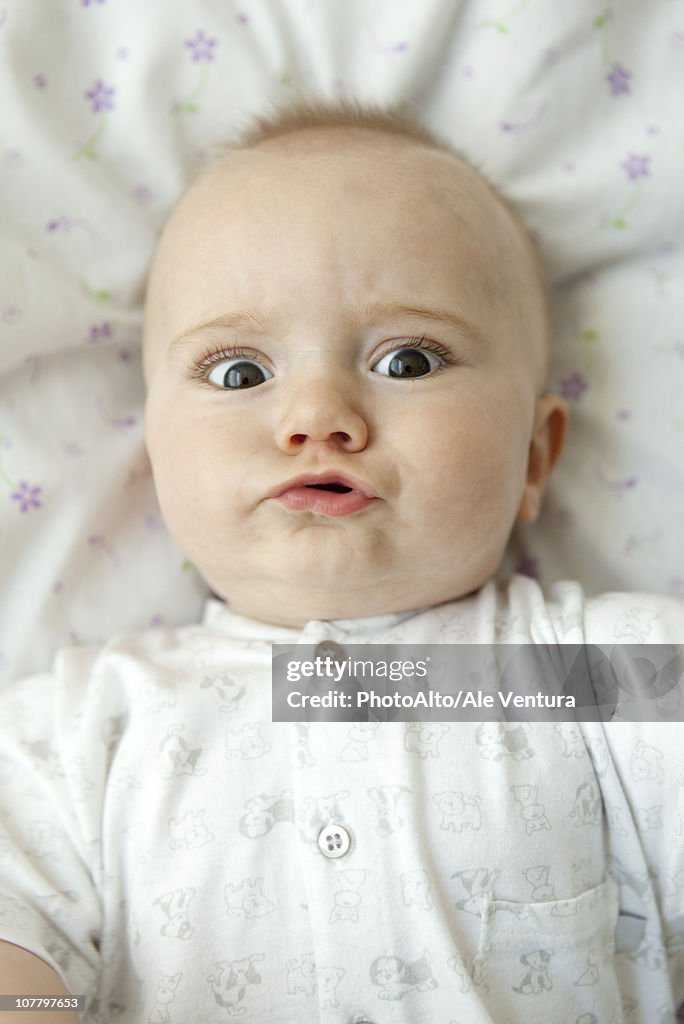 Baby making faces at camera, portrait