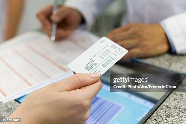 health insurance helps patients get the medical care they require - id card stock pictures, royalty-free photos & images