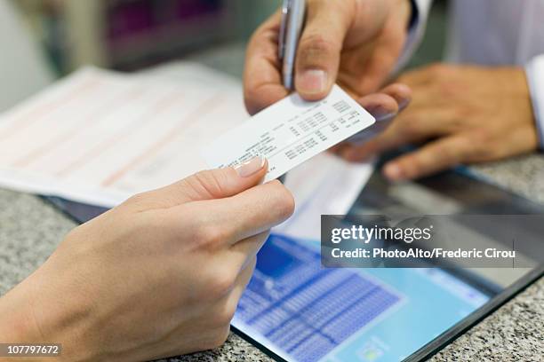 health insurance helps patients get the medical care they require - identity card fotografías e imágenes de stock