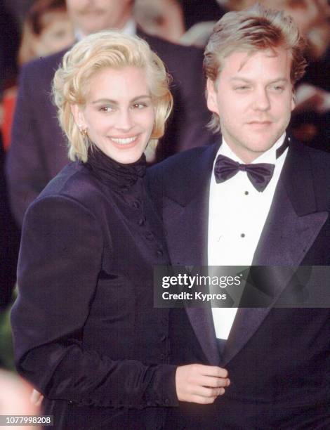 American actress Julia Roberts and her partner, Canadian actor Kiefer Sutherland attend the 63rd Academy Awards at the Shrine Auditorium Los Angeles,...