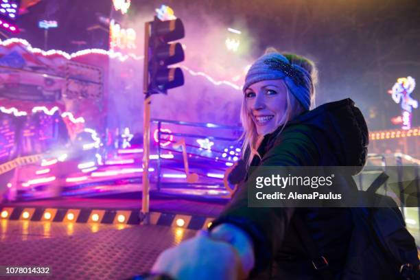 follow me, young woman visiting fair park at night - light to night festival 2018 stock pictures, royalty-free photos & images