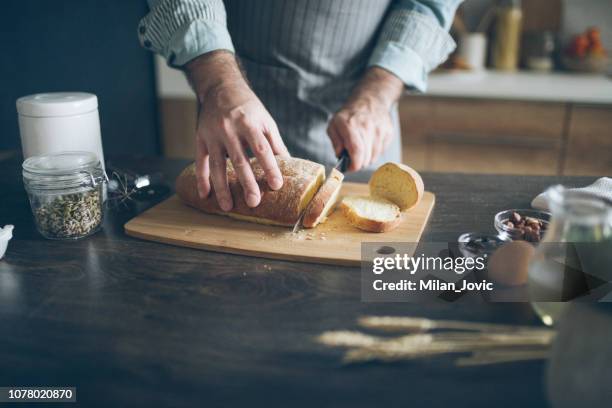 pastry chef serving a loaf of bread - cornbread muffins stock pictures, royalty-free photos & images
