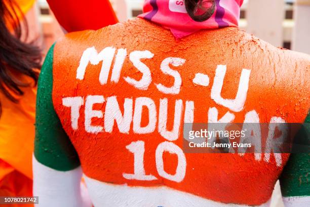 Sachin Tendulkar's lifelong fan, Sudhir Kumar Chaudhary displays his painted back during day four of the Fourth Test match in the series between...