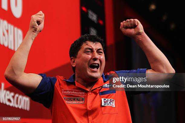 Mensur Suljovic of Austria celebrates his win against James Wade of England during day 10 in the 2011 Ladbrokes.com World Darts Championship at...