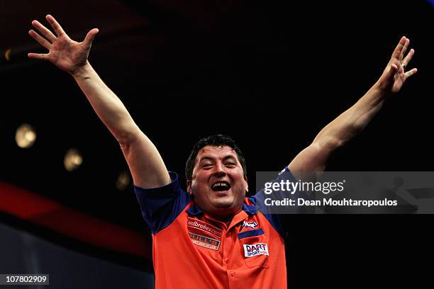 Mensur Suljovic of Austria celebrates his win against James Wade of England during day 10 in the 2011 Ladbrokes.com World Darts Championship at...