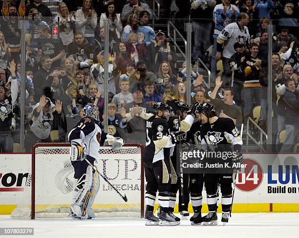 Craig Adams of the Pittsburgh Penguins celebrates his second period goal with teammates against the Atlanta Thrashers at Consol Energy Center on...