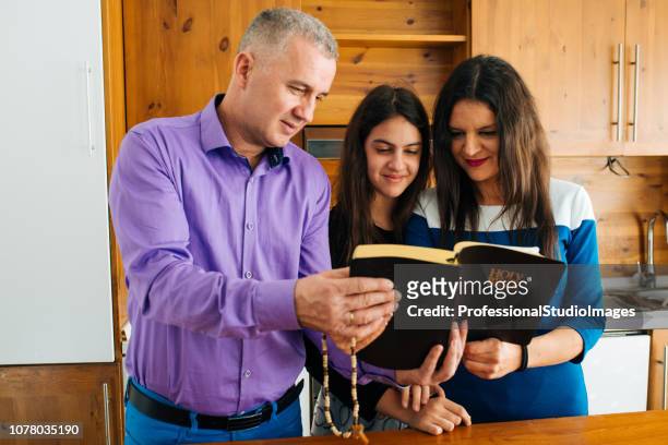 reading the words of god - child praying school stock pictures, royalty-free photos & images