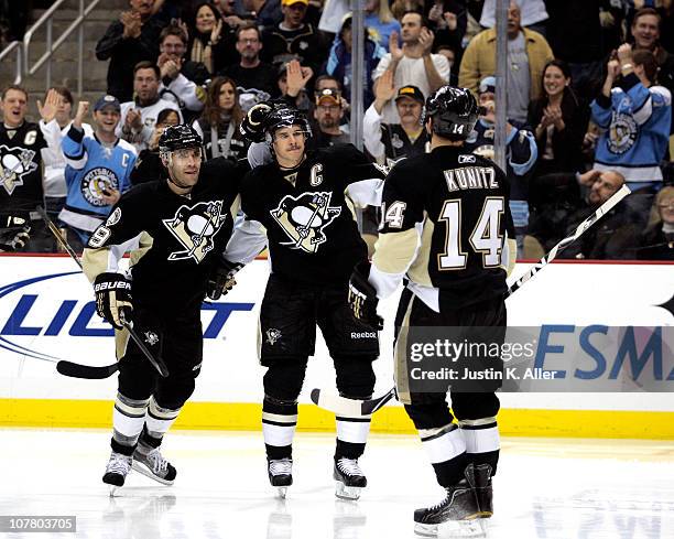 Chris Kunitz of the Pittsburgh Penguins celebrates his third period goal with teammates Sidney Crosby and Pascal Dupuis against the Atlanta Thrashers...