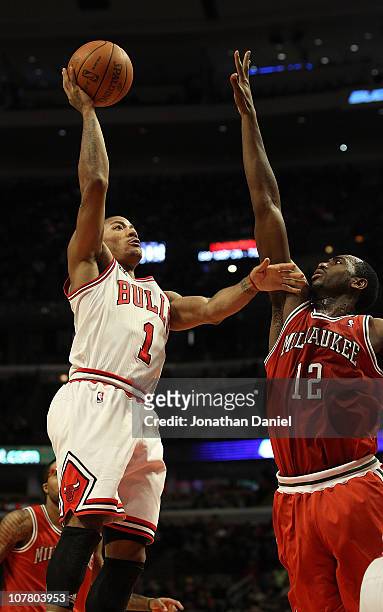 Derrick Rose of the Chicago Bulls shoots over Luc Mbah a Moute of the Milwaukee Bucks at the United Center on December 28, 2010 in Chicago, Illinois....