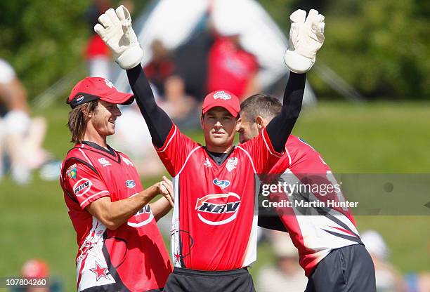Reece Young of the Wizards celebrates with team mates during the HRV Cup Twenty20 match between the Canterbury Wizards and the Northern Knights at...