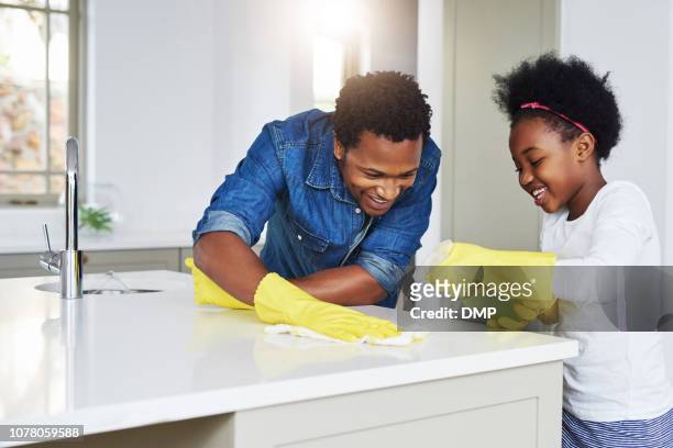 don't tell mom that dad helps me with my chores - household cleaning stock pictures, royalty-free photos & images