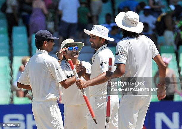 India's cricketers Rahul Dravid , Sachin Tendulkar, Zaheer Khan and Ishant Sharma celebrate their victory on the fourth day of the second Test...