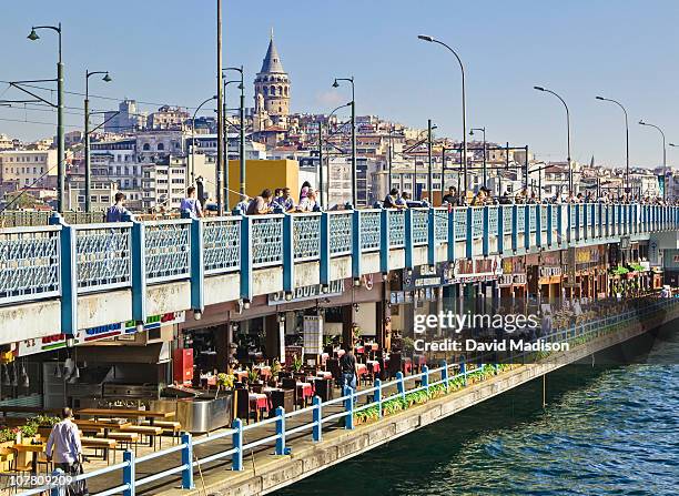 the galata bridge spans the golden horn. - istanbul bridge stock pictures, royalty-free photos & images