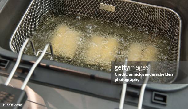 deep frying croquettes - freidora fotografías e imágenes de stock