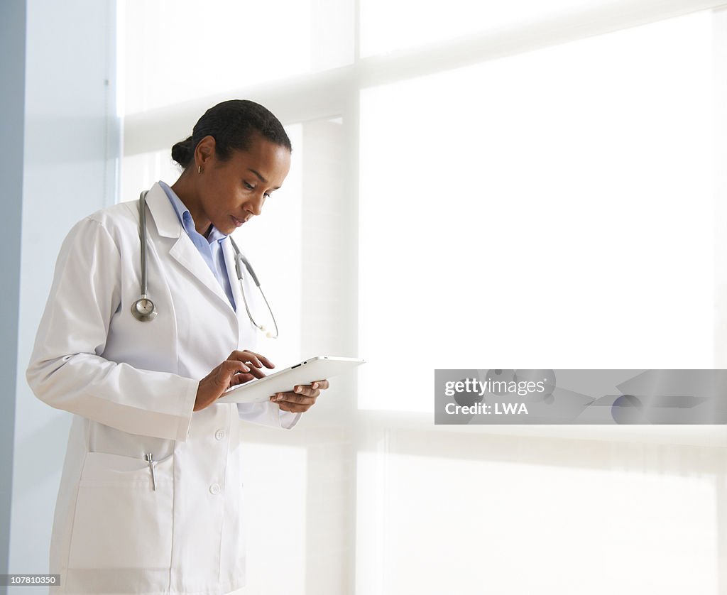 Female Doctor Using Digital Tablet